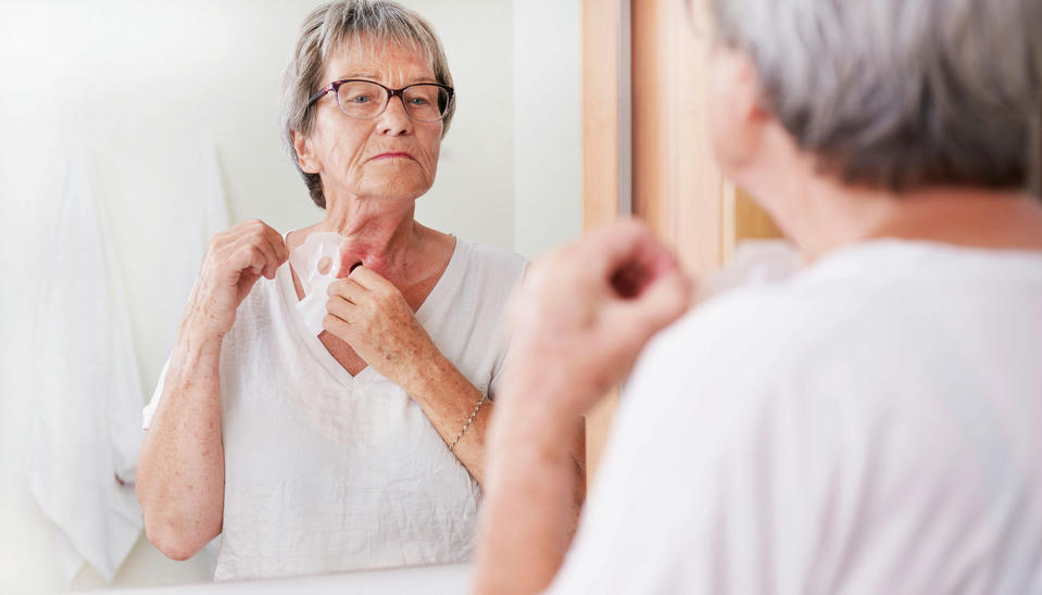 woman taking care of her stoma indoors